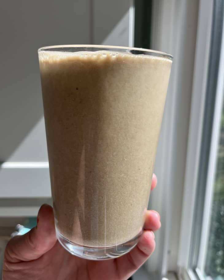 Banana coffee in pint glass, viewed from the side