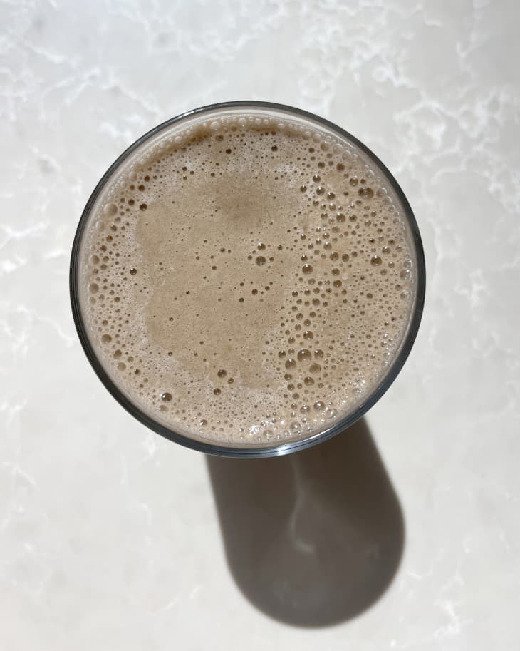 Banana coffee in pint glass, viewed from above