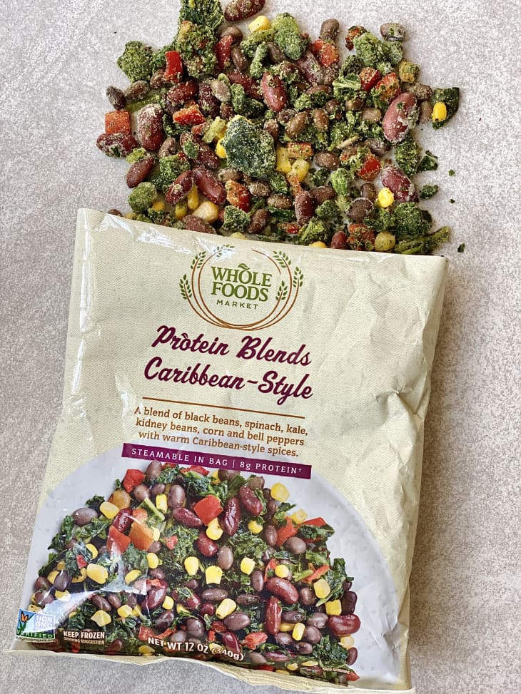 Opened package of Protein Blends Caribbean Style frozen vegetables with some of the vegetable spilled onto the counter.