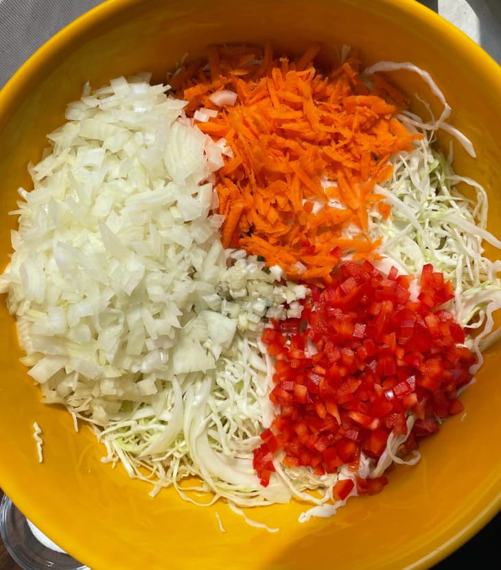 unmixed cole slaw ingredients in bowl