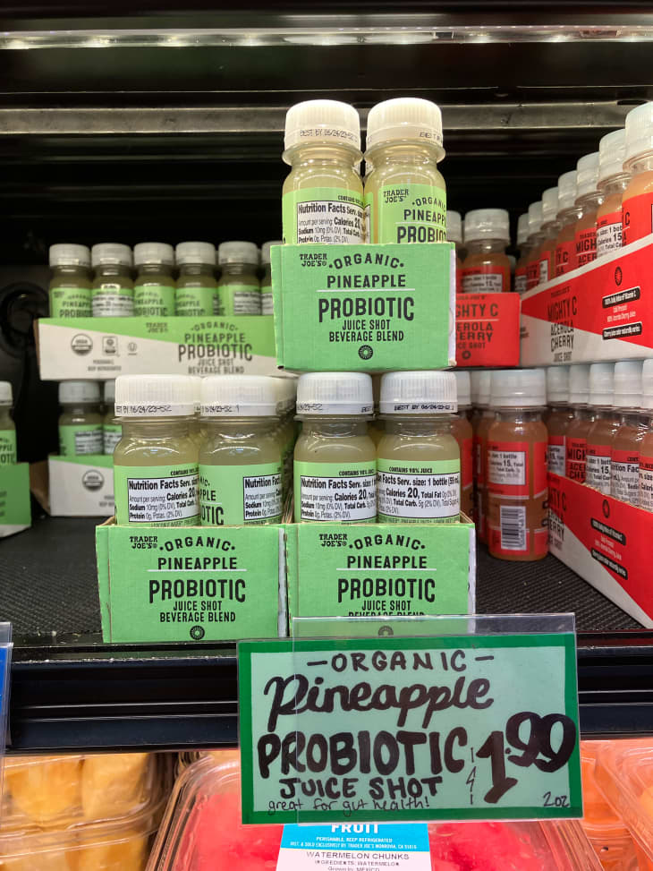 Pineapple probiotic shots in refrigerator at Trader Joe's.