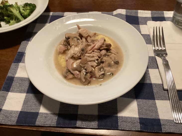 Grocery diary meal: chicken piccata over polenta in shallow bowl