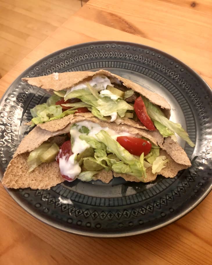 lettuce and tomato on whole wheat pita on plate