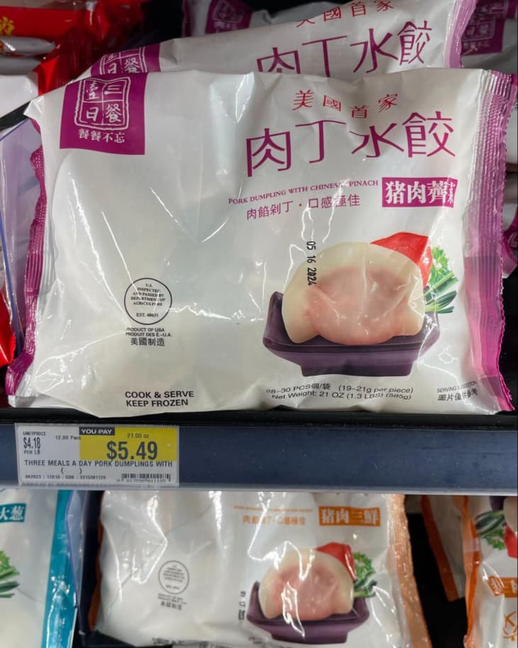 Three Meals a Day Pork Dumplings with Chinese Spinach on shelf in H Mart store