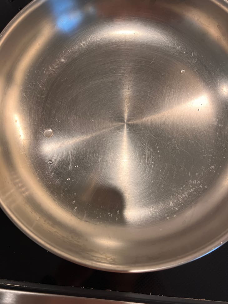 Stainless steel pan on stove.