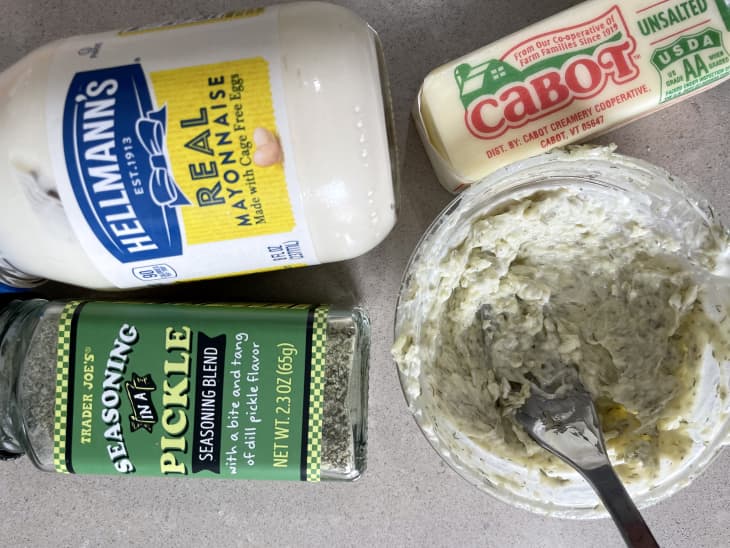 ingredients for grilled cheese sandwich bread: Hellman's Mayonnaise, Trader Joe's Pickle Seasoning Blend, stick of Cabot unsalted butter, bowl with these ingredients mixed together with a fork