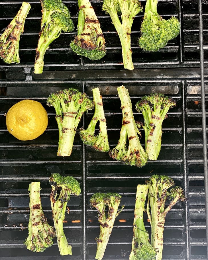 grilled broccoli with a half grilled lemon, squeezed