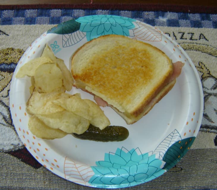 Ham sandwich with side of chips.