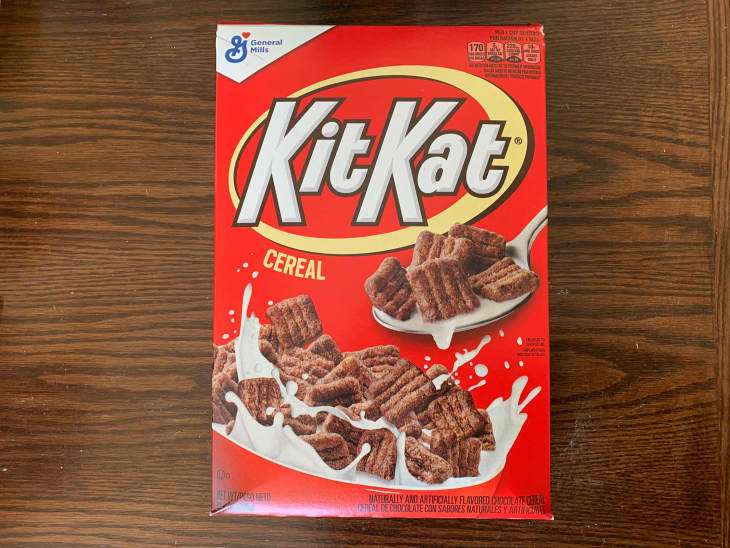 Kit Kat cereal on wooden surface.
