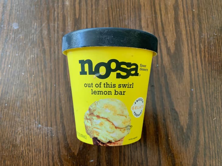 Noosa ice cream on wooden surface.