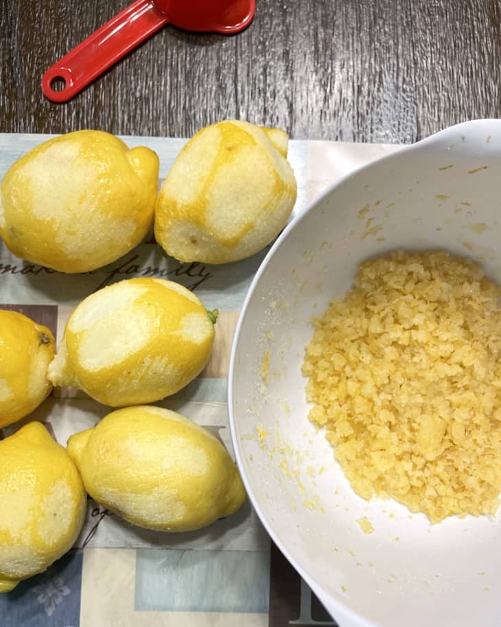 Lemons, lemon zest in a bowl, prepping to make best lemonade.