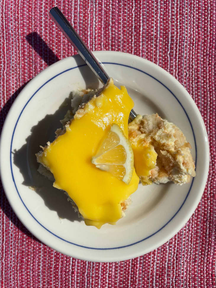 Lemon tiramisu on a plate with fork on the side.