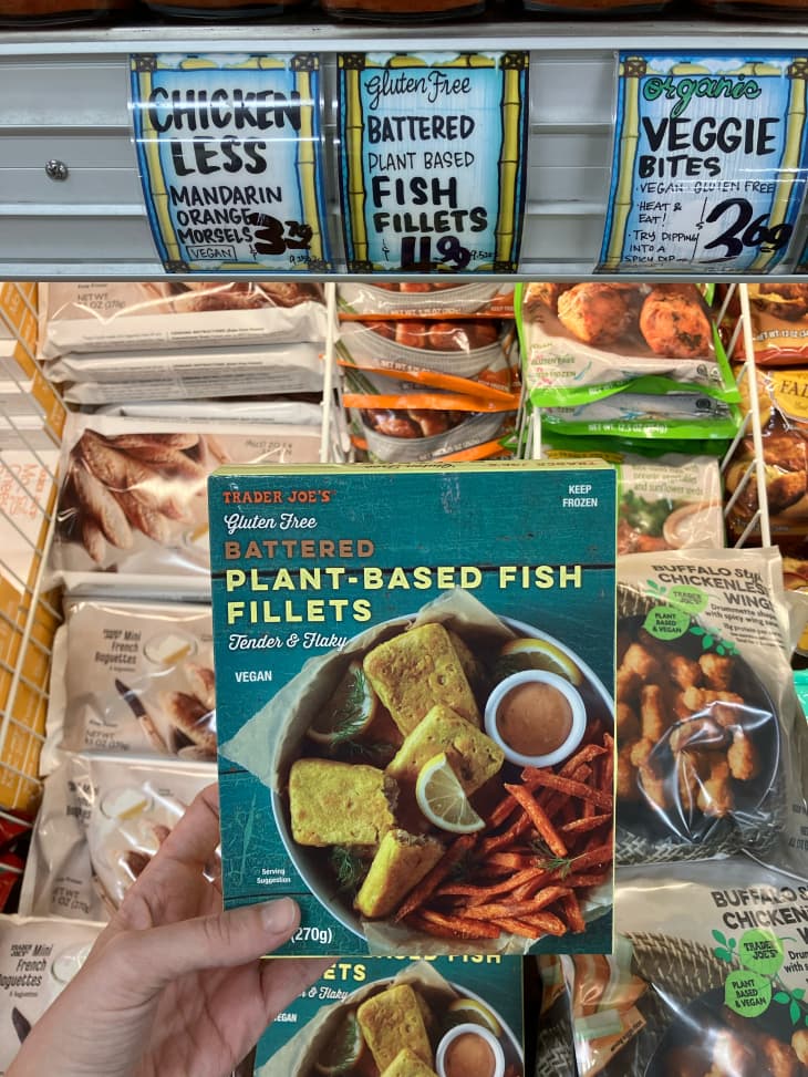 Someone holding a package of Trader Joe's plant based fish.