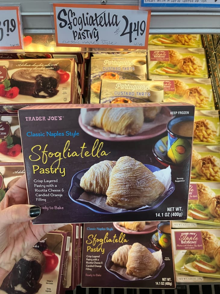 Someone holding a package of Trader Joe's sfogliatella pastry.