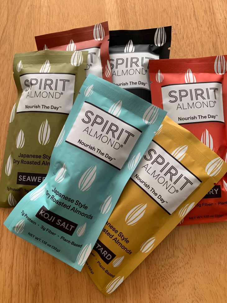 Various packets of Spirit almonds on suface.