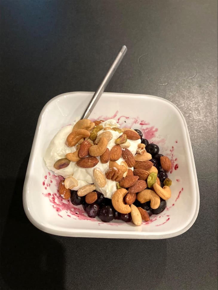 Yogurt with nuts in a bowl.