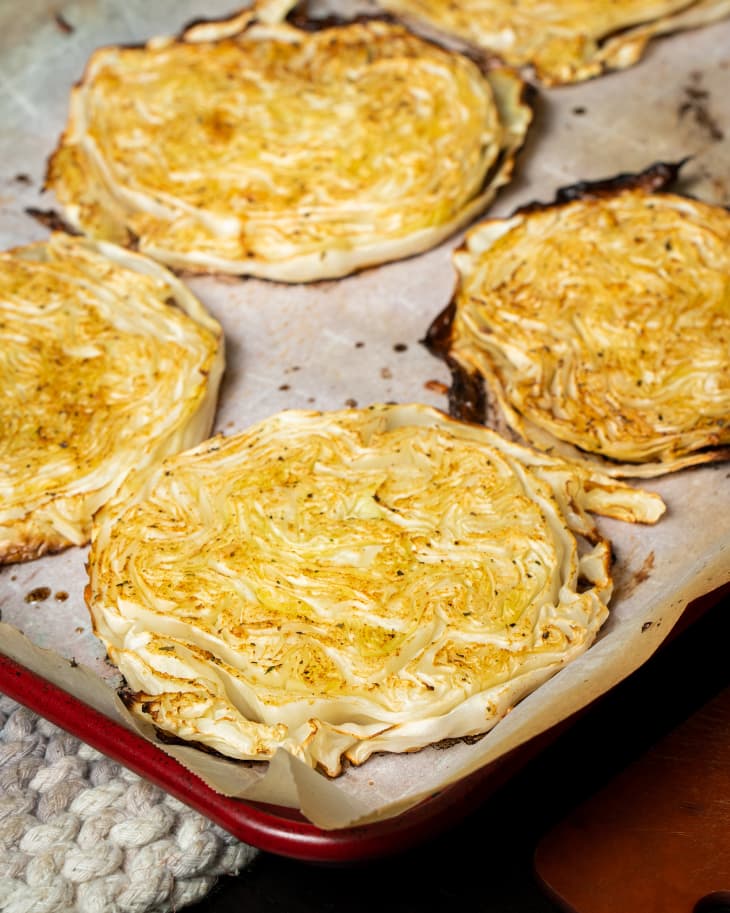 cheesy cabbage steaks on pan