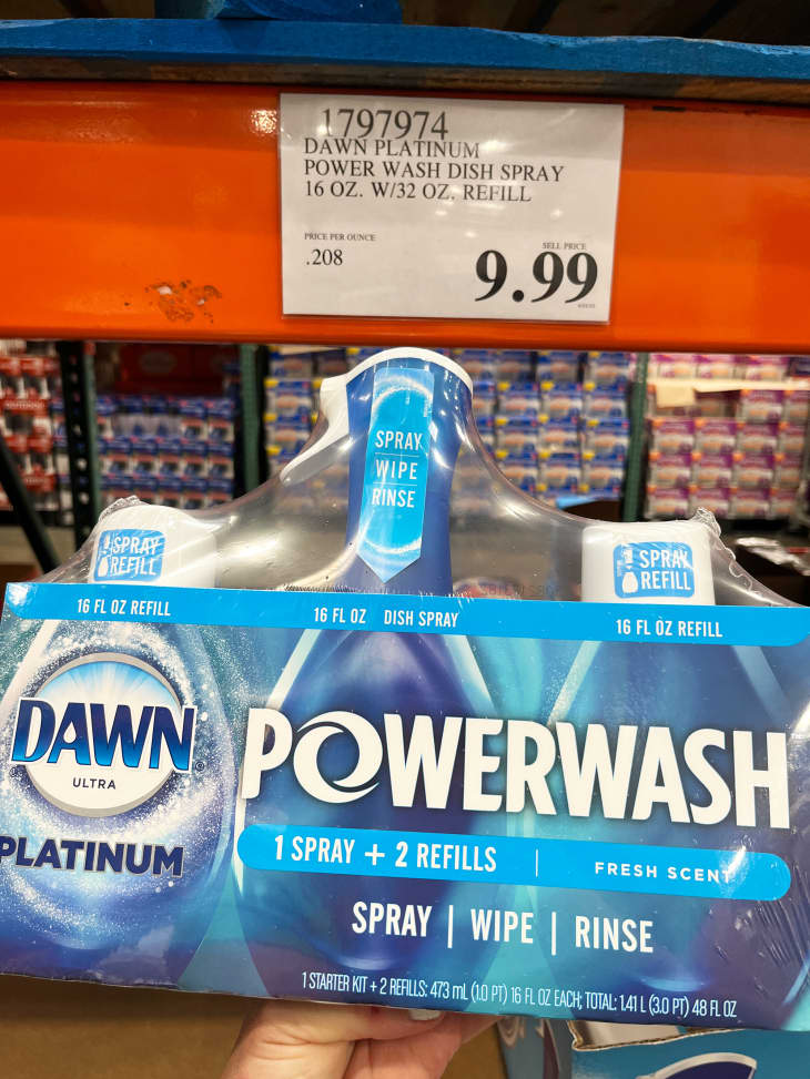 Someone holding package of Dawn Powerwash dish soap in Costco.