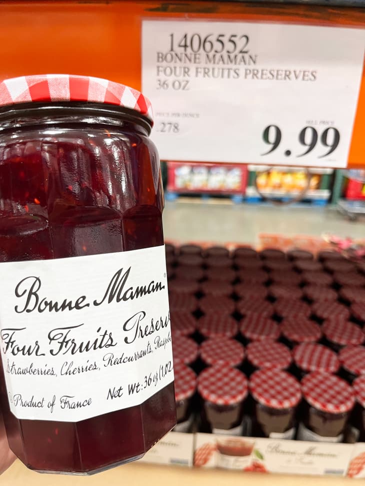 Someone holding up jar of Bonne Maman in Costco.