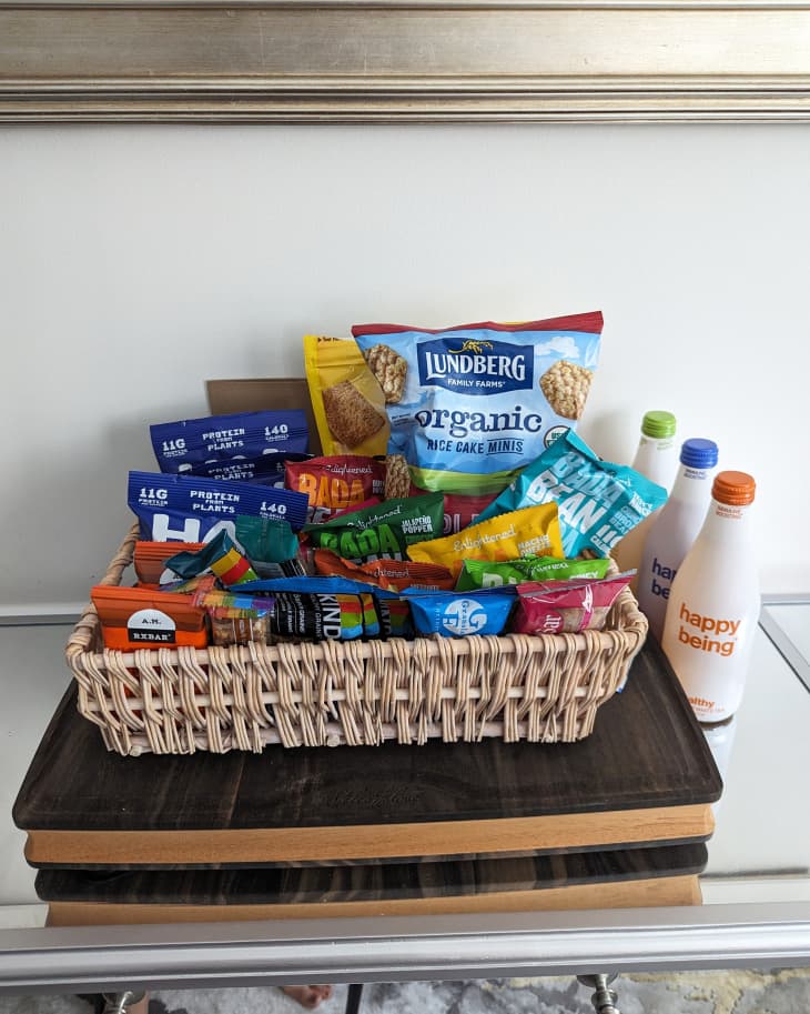 Pantry snacks and food items collected in a basket and placed on a table