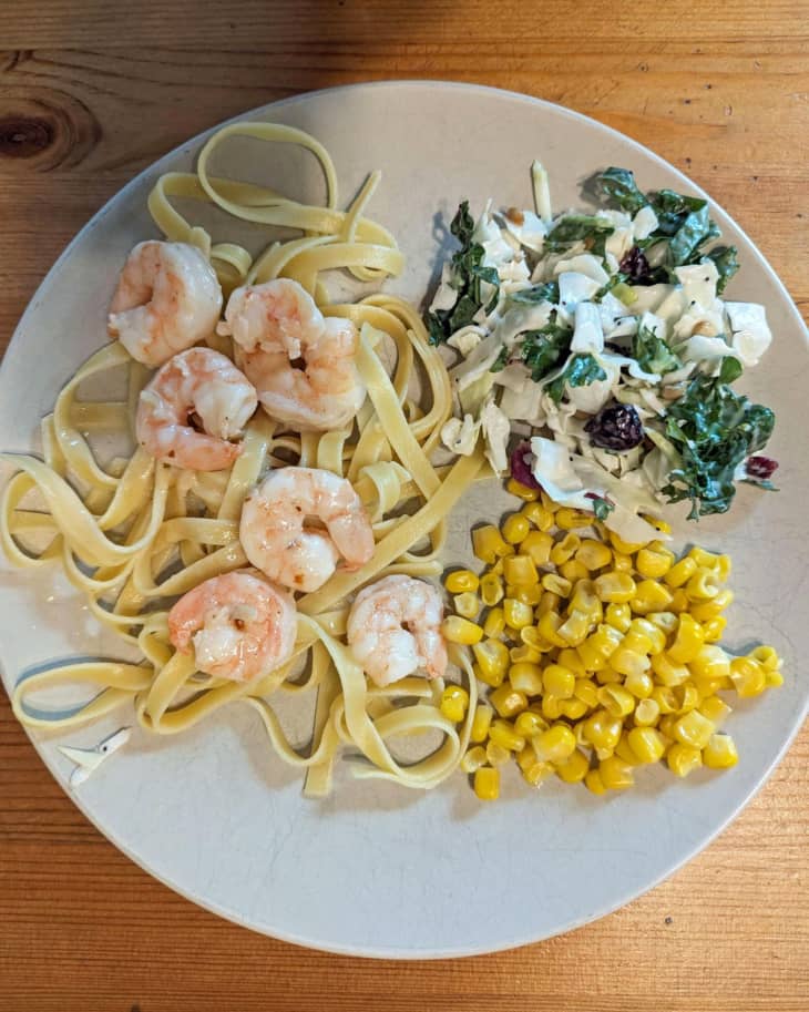 corn, shrimp, fettuccini, spinach, white plate, wood table