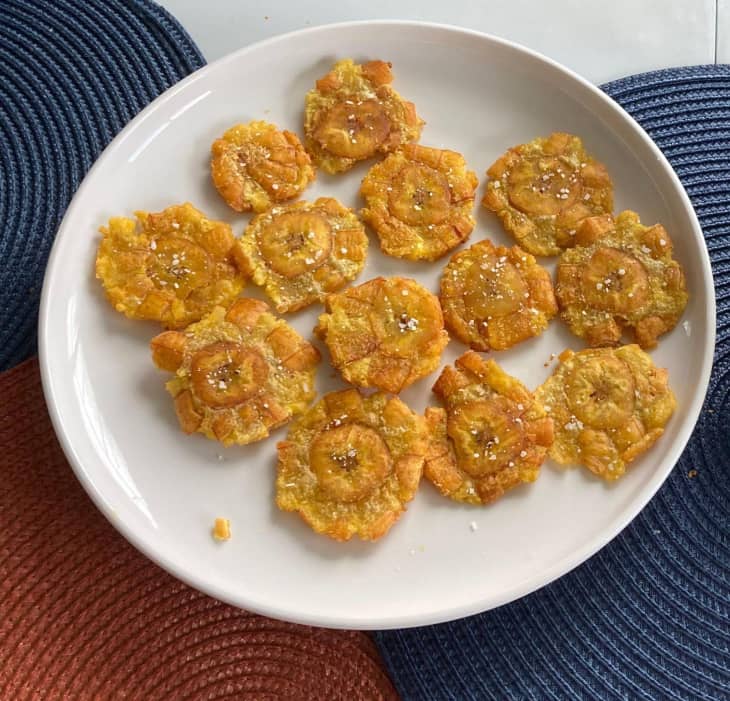 Plate of fried plantains with salt sprinkled on top.