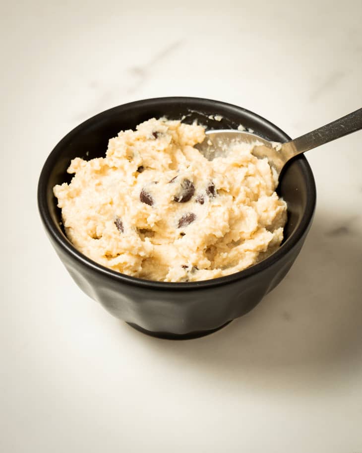 cottage cheese cookie dough in black small serving bowl with spoon