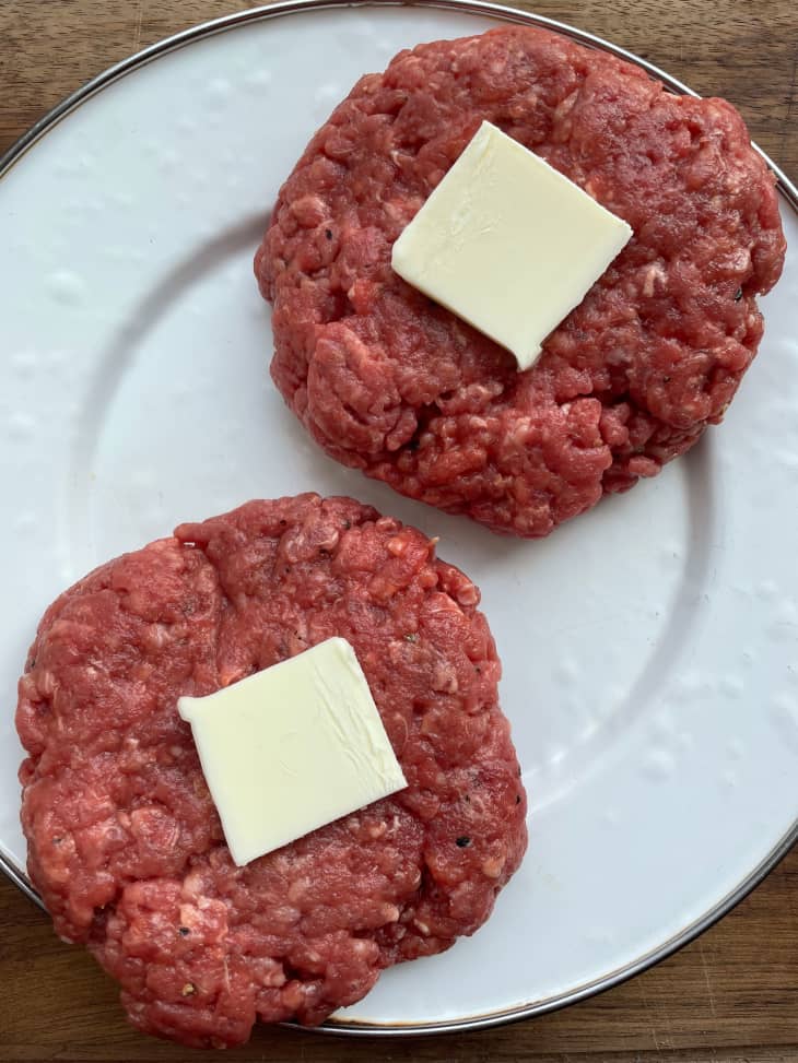 Pats of butter on beef patties.