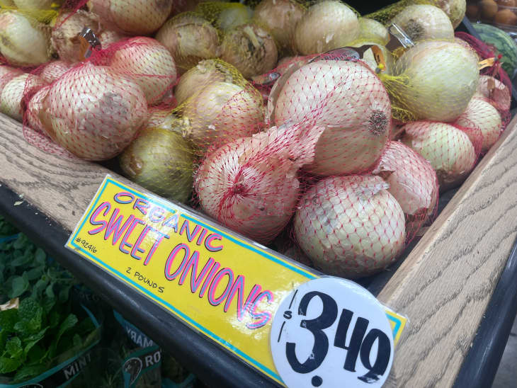 Bagged sweet onions on display at Trader Joe's