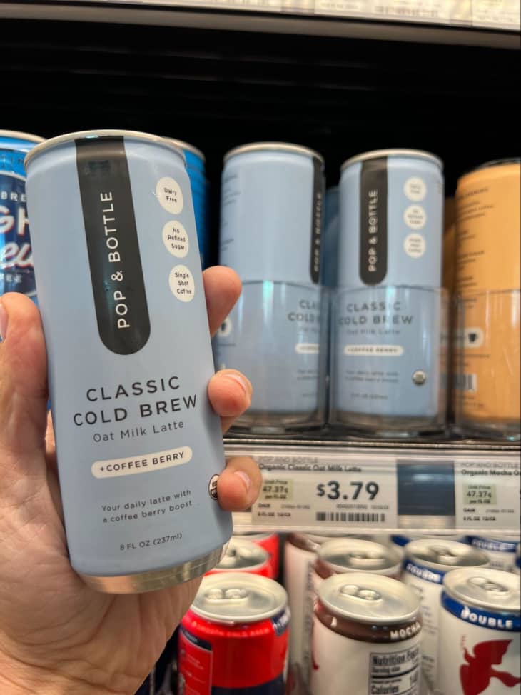 Someone holding can of Cold Brew coffee.