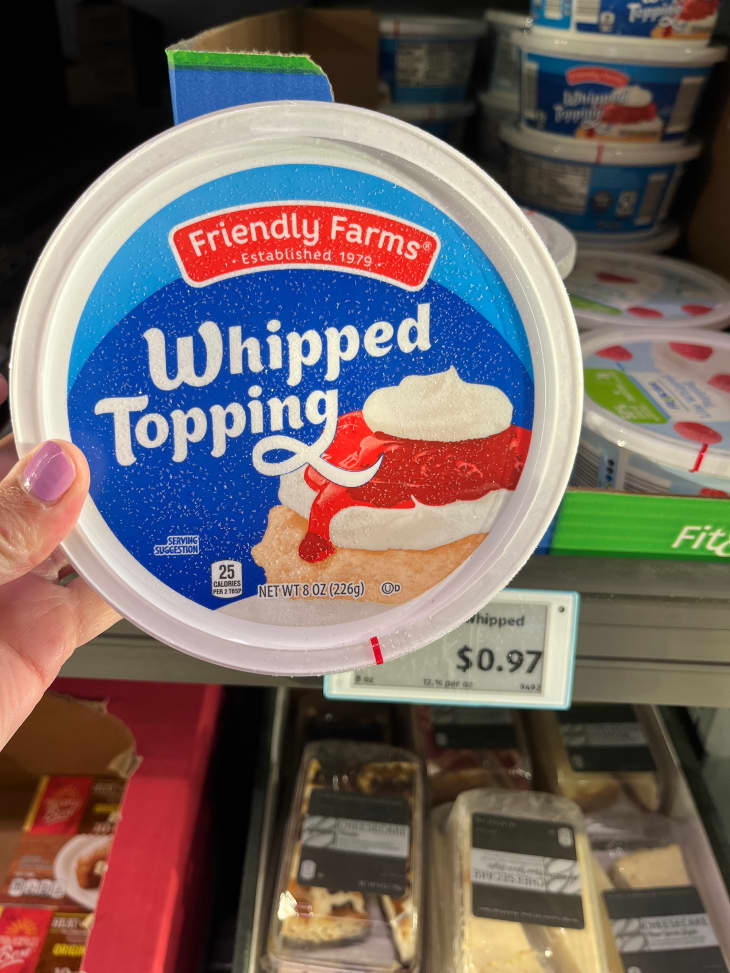 Someone holding whipped cream