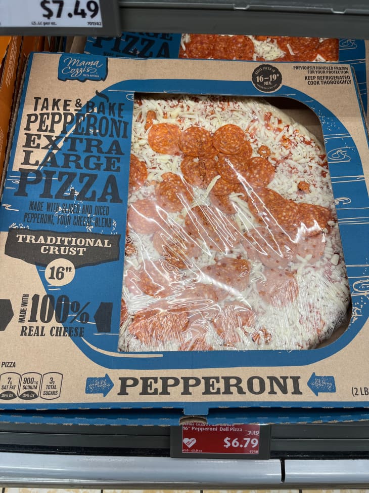 Large pepperoni pizza in box.