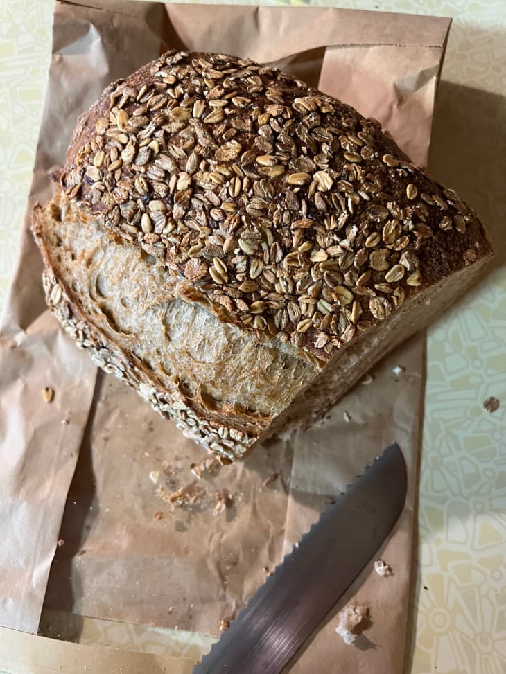 Whole grain bread sliced on table.