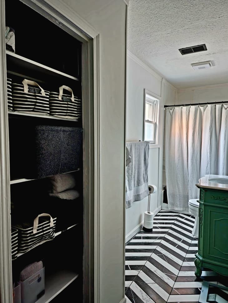 A bathroom with striped tile.