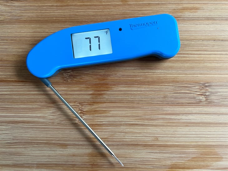 Thermoworks thermapen on wooden surface.