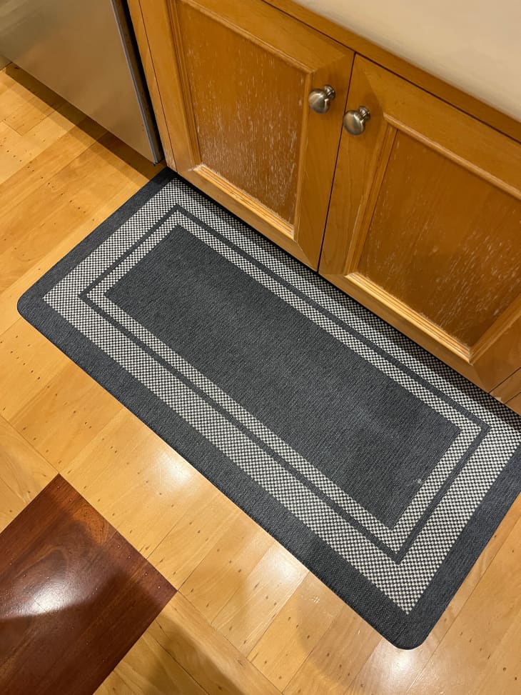 Costco kitchen mat on kitchen floor.
