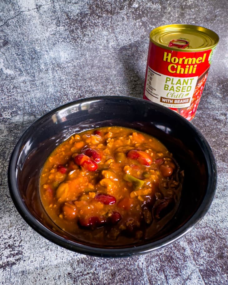 bowl of red chili with can in background