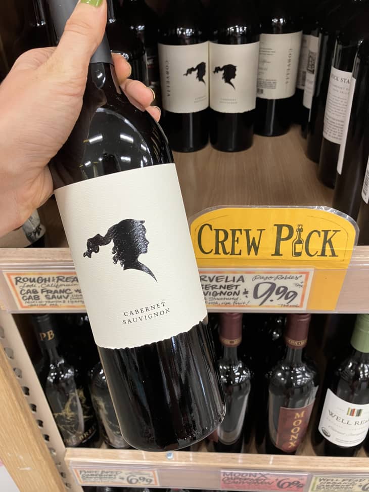 red wine bottles on shelf in trader joes