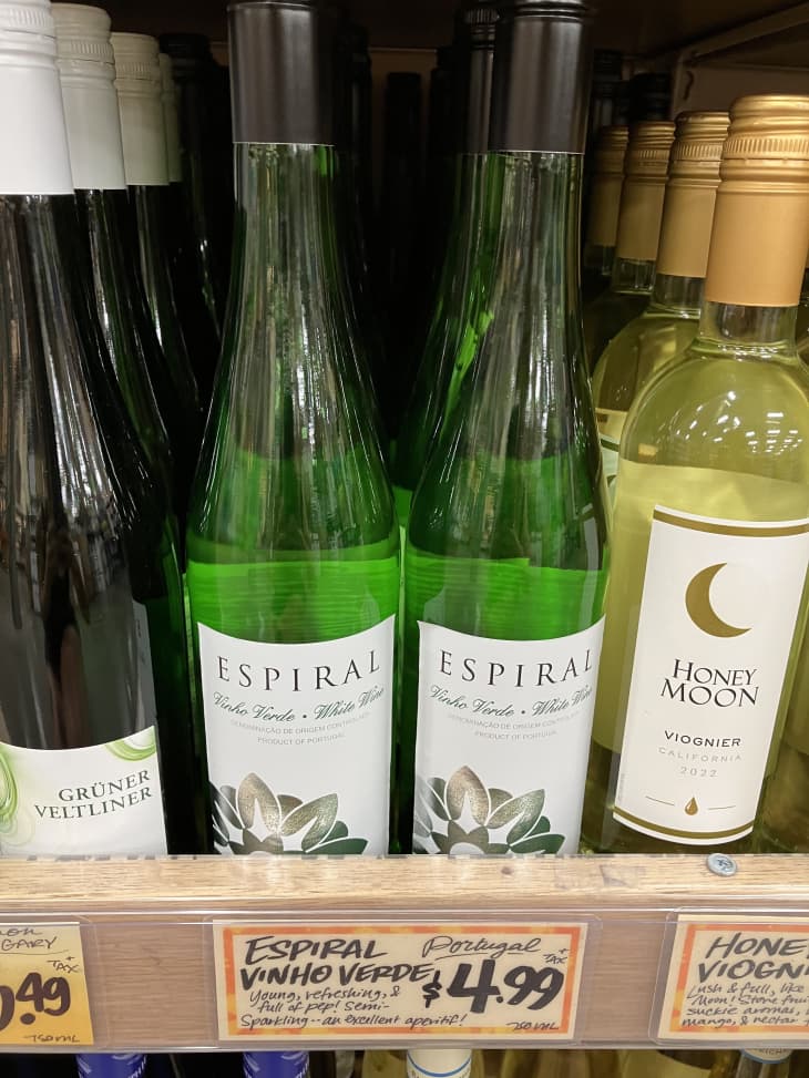white wine bottles on shelf in trader joes