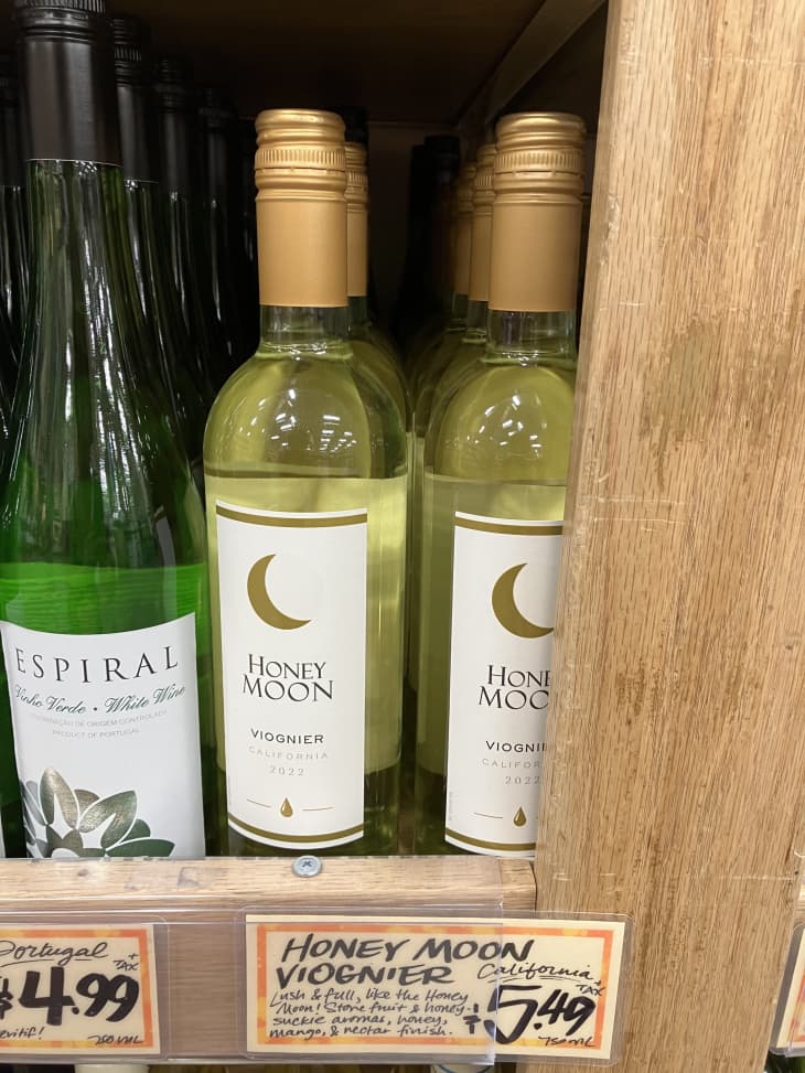 white wine bottles on shelf in trader joes