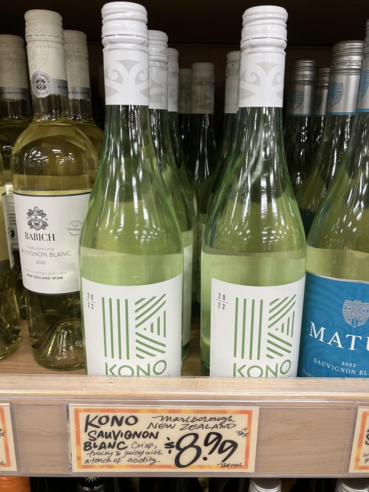 white wine bottles on shelf in trader joes