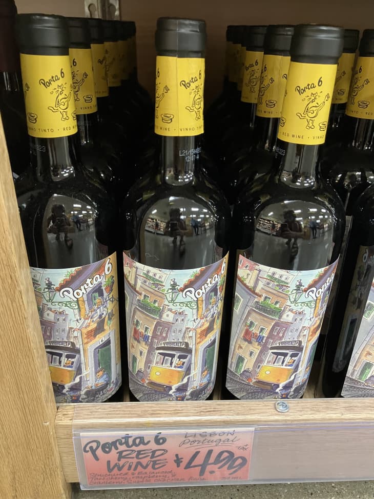 red wine bottles on shelf in trader joes