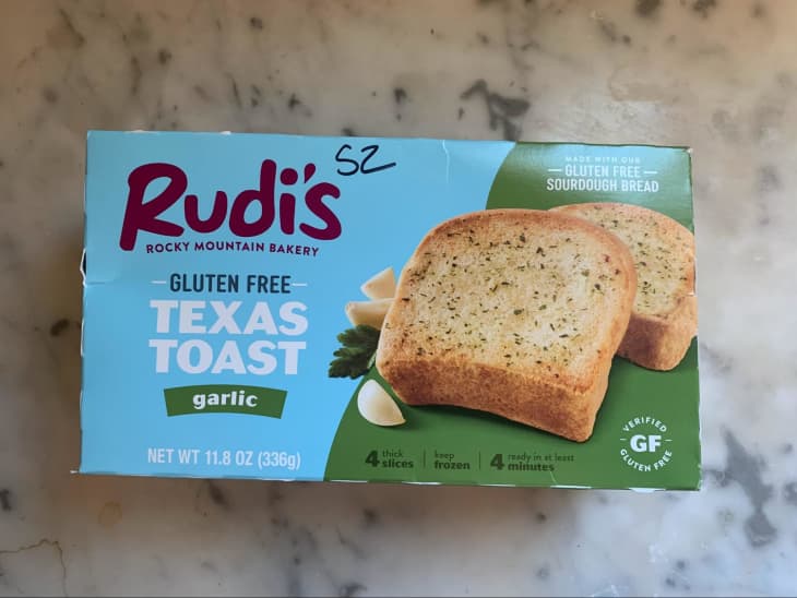 green and blue box of frozen garlic texas toast with pictures of toast and garlic on front