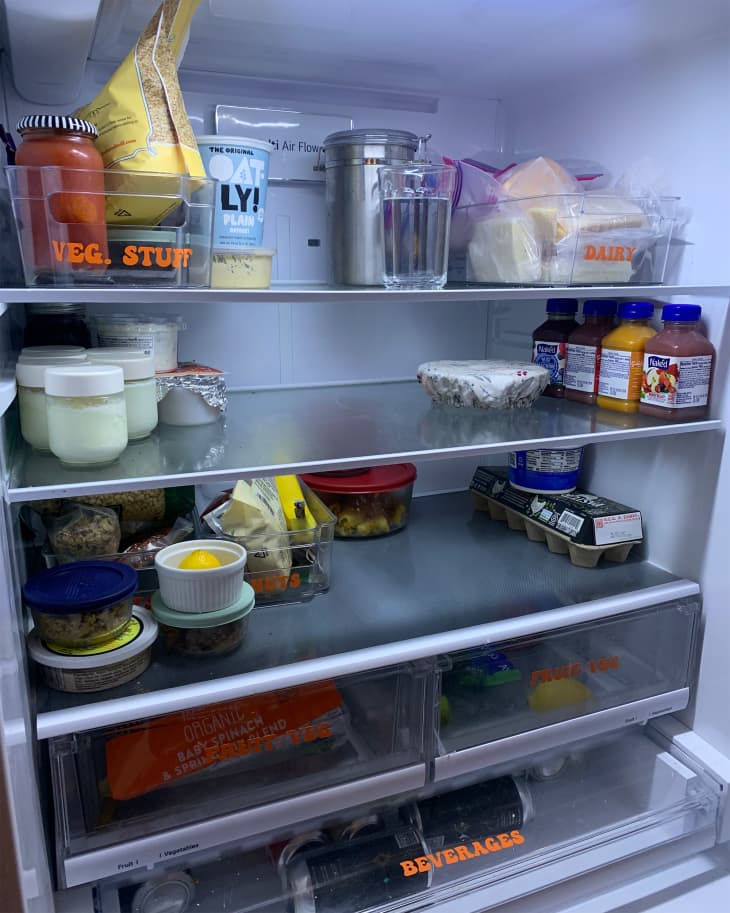 Groceries organized in refrigerator.