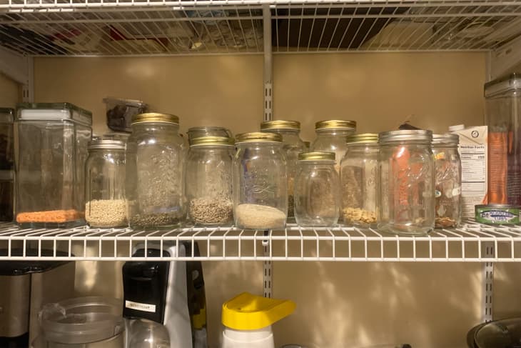 Pantry dry goods stored in glass containers.