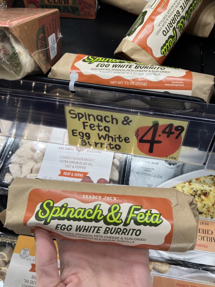 spinach and feta egg white burrito in refrigerated section on shelf in brown paper wrapping