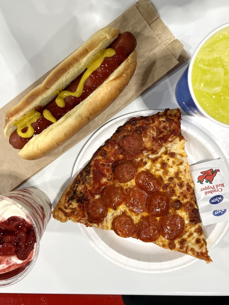 Hot dog meal with pizza and other Costco items.