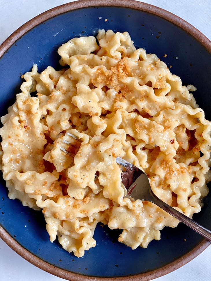 Creamy miso butter pasta topped with bread crumbs in bowl.