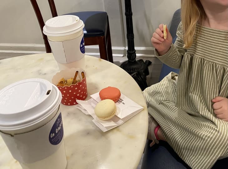 Cafe table with coffee drinks and macarons