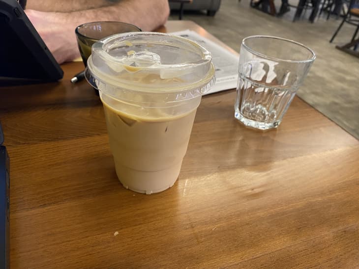 Iced honey bun latte on a cafe table